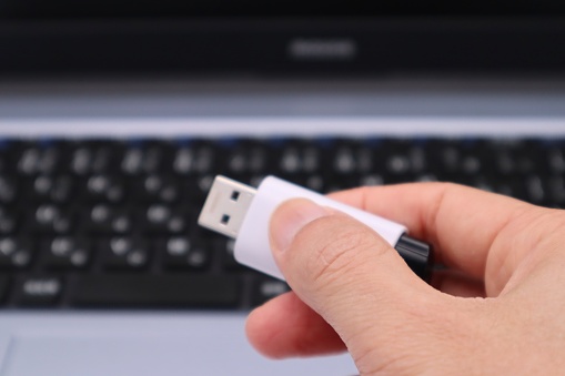 Photo of a person holding a USB memory