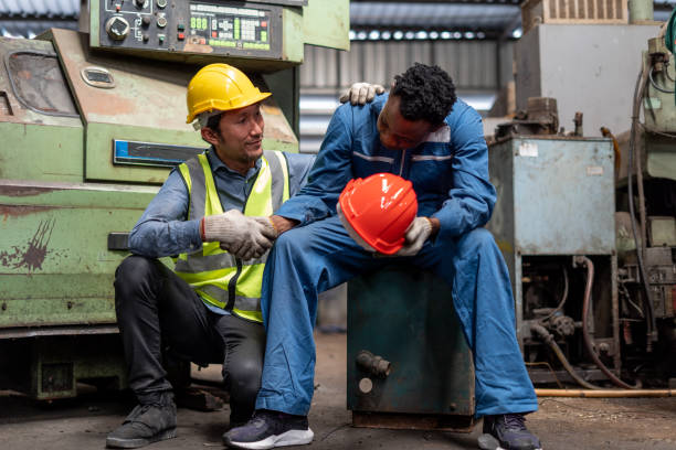istock tried african american engineer worker so sad sitting take a break burn out of from hard work disappointed with the economy and asian empleyee man consoling . Helping and encouragement in the workplace 1593464834