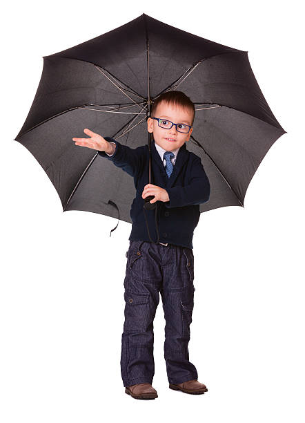 istock Boy in black clothes standing under umbrella 159348798