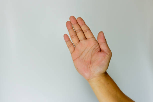 istock Young man waving saying greeting, goodbye making hand gestures isolated over blue background. Copy space for place a text, message for advertisement. Advertising area, mock up promotional content. 1593495140