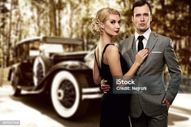 Retro Couple Against Old Car Stock Photo - Download Image Now - 1960-1969, Car, Gangster