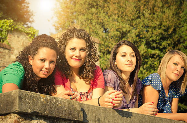 Friends enjoy in the park, posing together