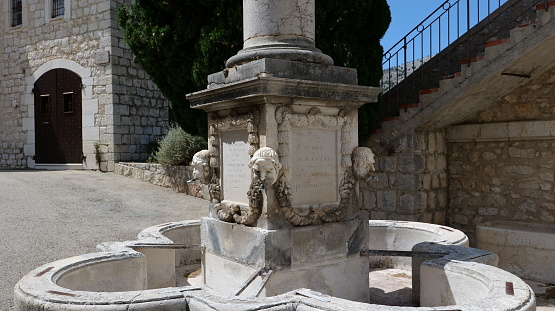 The fountain at the entrance to the village of Gourdon, dating from 1852. It is dedicated to the memory of Jean-Louis Cavalier, who bequeathed 20,000 francs for the construction of a public fountain in his will dated 18 July 1847.