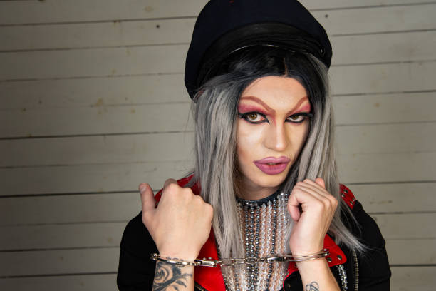 istock Drag queen in a provocative outfit poses in the studio. 1593610180