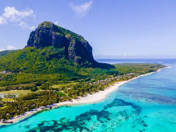 droen aerial vie at Le Morne beach Mauritius Tropical beach with palm trees and white sand blue ocean