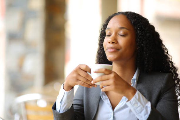 istock Executive relaxing drinking and breathing in a coffee shop 1593628126