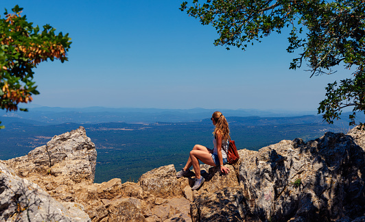 Woman enjoying beautiful France panorama view- Pic saint loup near Montpellier