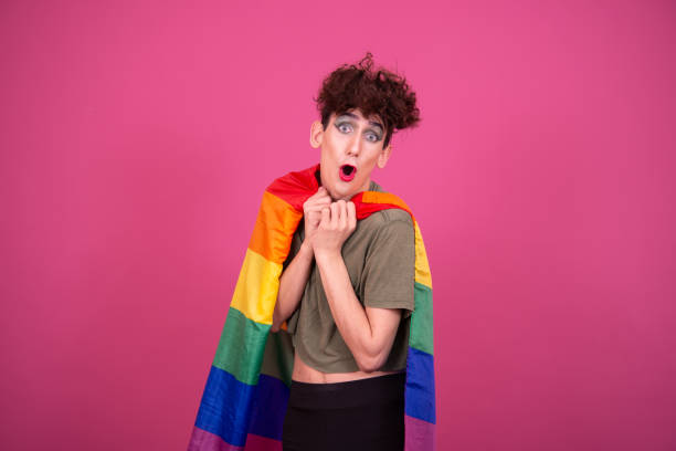istock Make up. Funny drag queen posing in the studio on a pink background. 1593632039