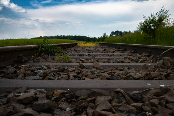 istock Low angle view of abandoned railroad tracks 1593647124