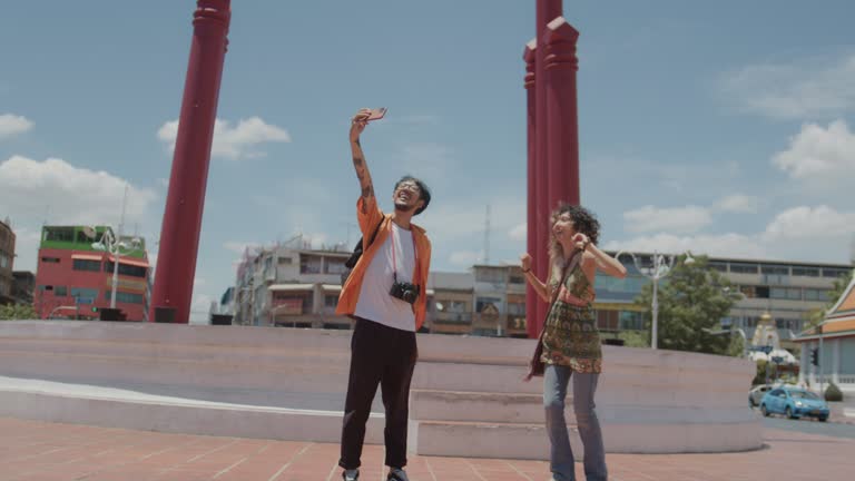 Happy couple have a special time and selfie together at the giant swing 