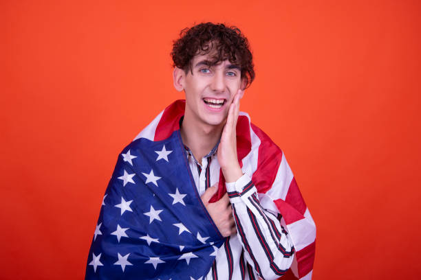 istock Young attractive guy with usa flag. 1593656172