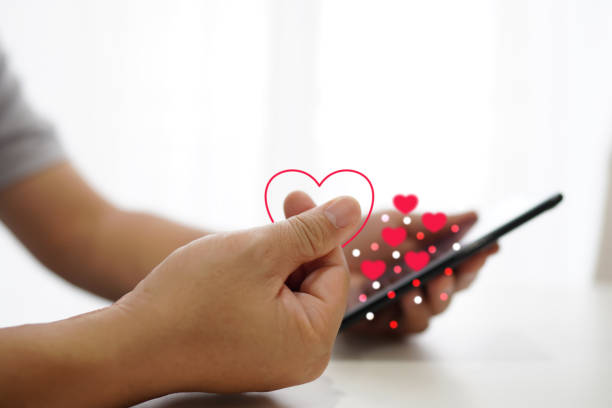 istock Young man making a small finger on the heart Expressed as commun 1593696353