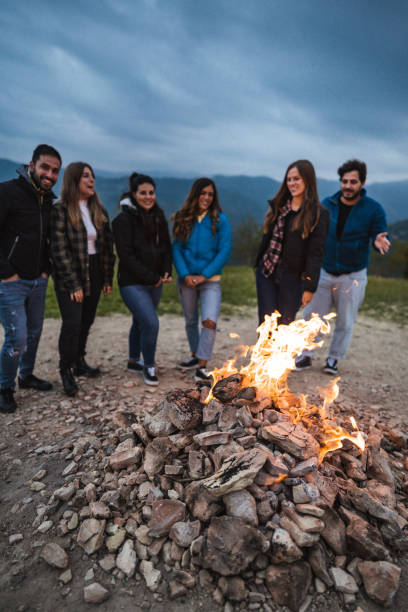 istock friends in front of the campfire all together 1593710939
