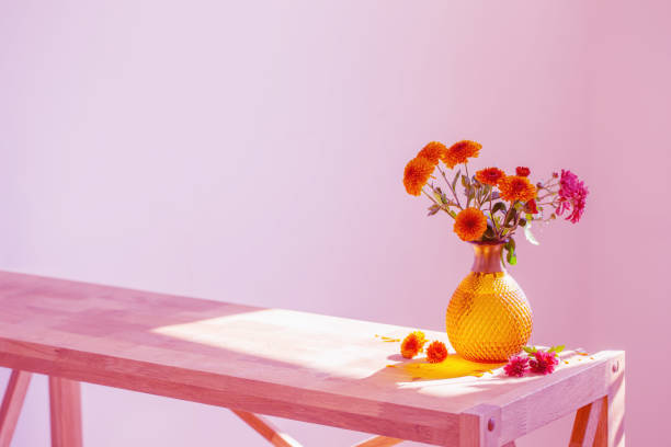 istock chrysanthemums in glass vase on pink background 1593758431