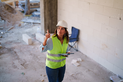 Series of an interior designer working on the construction site