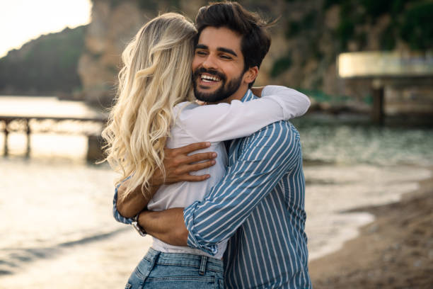 istock Handsome male proposed his girlfriend at the beach 1593793291