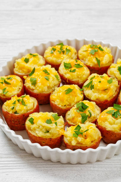 istock baked stuffed red potato on white baking dish 1593819810