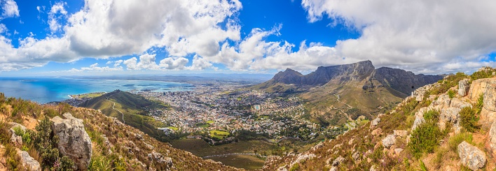 This stunning image features a panoramic view of Cape Town and Table Mountain, with Signal Hill in the foreground