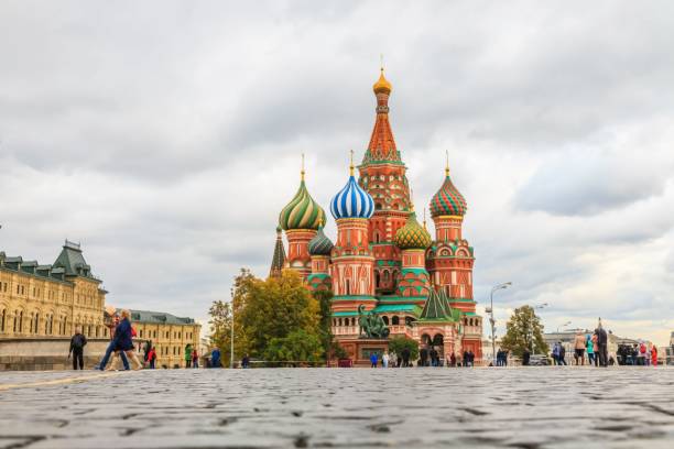 istock several people are walking in front of st basil cathedral and another building 1593860353