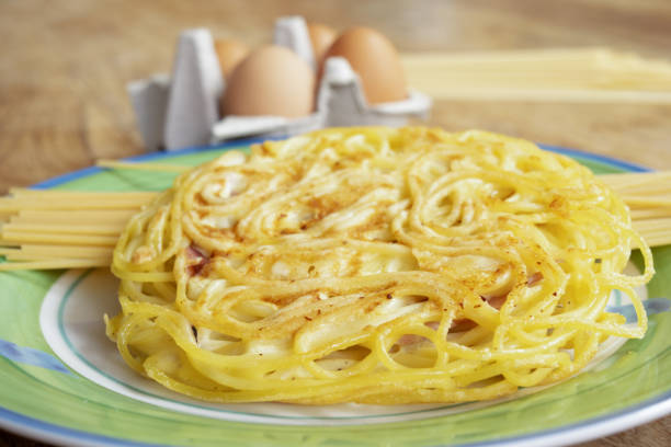pasta omelette with together some of the ingredients to prepare it