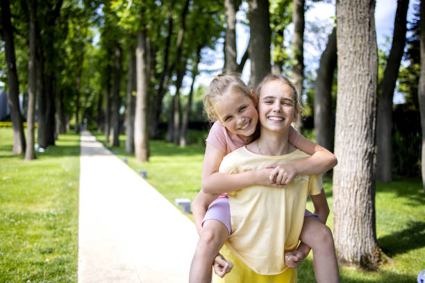 Free Stock Photo of Full-lenght outdoor portrait of two friendly happy ...