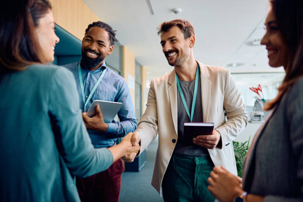 istock Happy business people greeting while meeting in the office. 1593965552