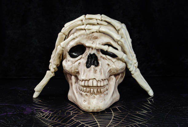 istock A skull Halloween decoration and skeleton hands posing 1593988210