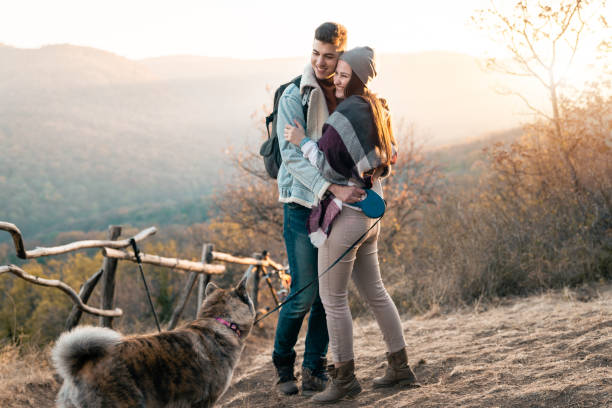 istock Attractive couple spending day in nature with their pet 1594048363