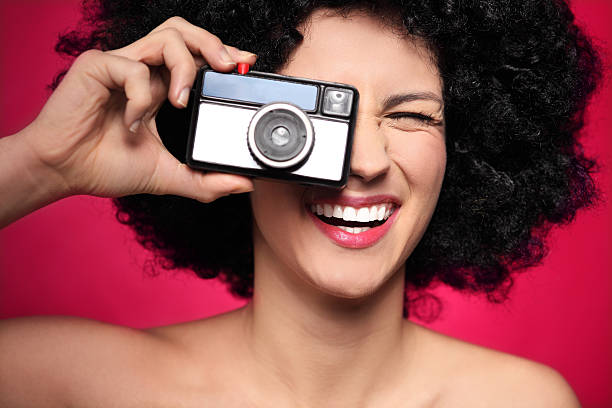 istock Woman with vintage camera 159406127