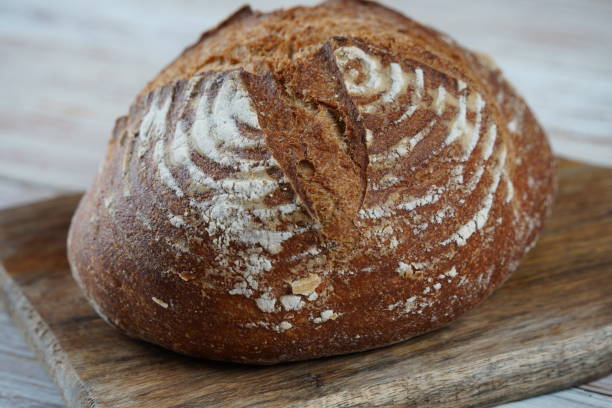istock Fresh rye bread or whole grain bread. Healthy baked bread with crispy crust 1594071954