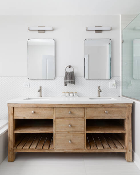 istock A bathroom detail with a white oak cabinet and herringbone backsplash. 1594072435