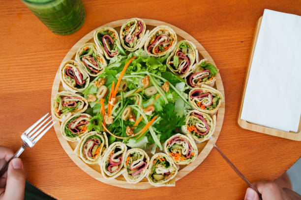 Slices of rolled sandwich wrapped in soft tortilla bread