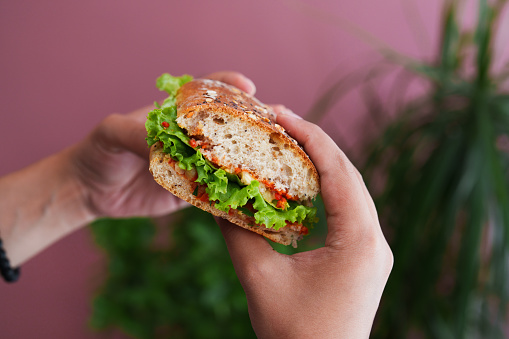 Mixed sandwich between whole grain bread.