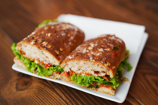 Mixed sandwich between whole grain bread.