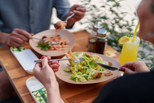 istock Eating a chicken salad at a sidewalk cafe. 1594113547