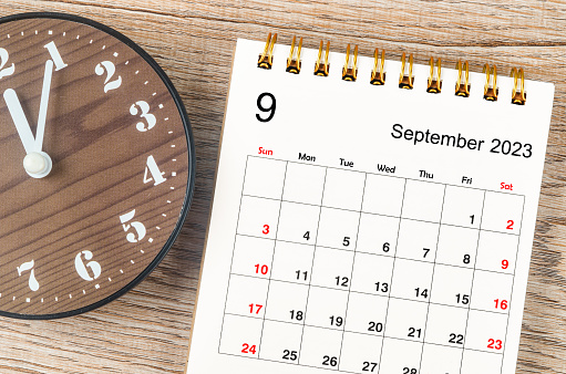 September 2023 Monthly desk calendar for 2023 year with clock.