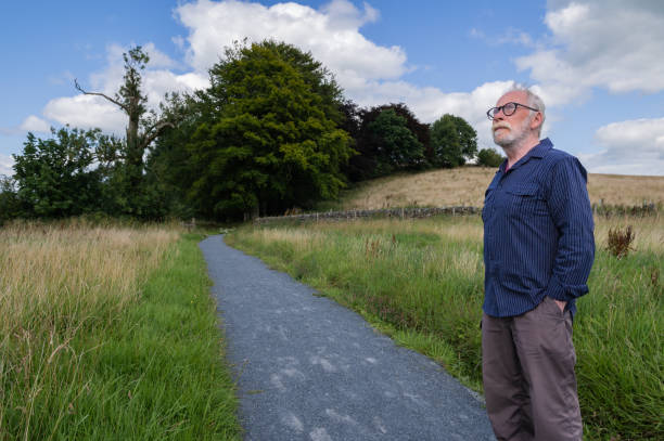 istock Mature man looking up to the sky 1594118609