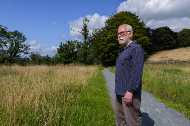 istock Senior man looking into the distance 1594118640