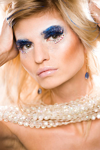 istock beauty young woman with creative make up 159415095