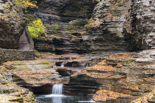 A series of waterfalls through a ravine within watkins glen state park in new york in autumn.
