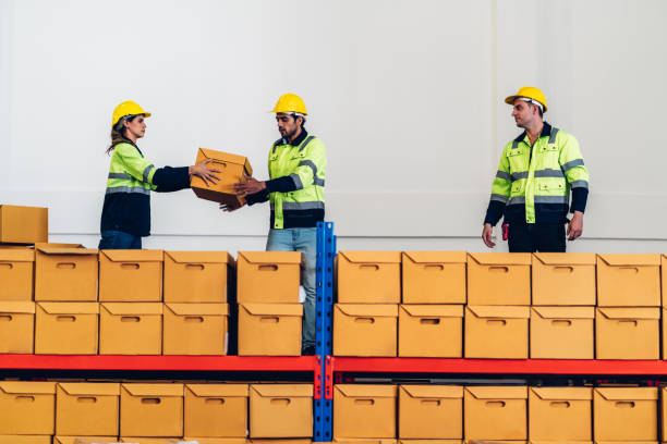 istock Warehouse worker working in warehouse storage. Foreman or worker work at factory site check up products in site. Inventory worker working in  factory Storehouse 1594164365