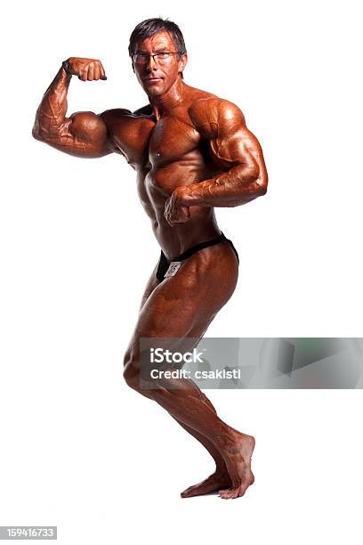 Bodybuilder Posing Stock Photo - Download Image Now - Anaerobic Exercise, Beautiful People, Beauty