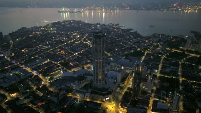 Aerial view of Komtar towers and Old city houses in George Town during sunrise in Pulau Penang. Malaysia