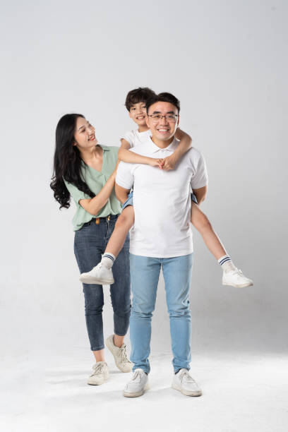 istock a family posing on a white background 1594196349