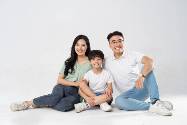 istock a family posing on a white background 1594196489