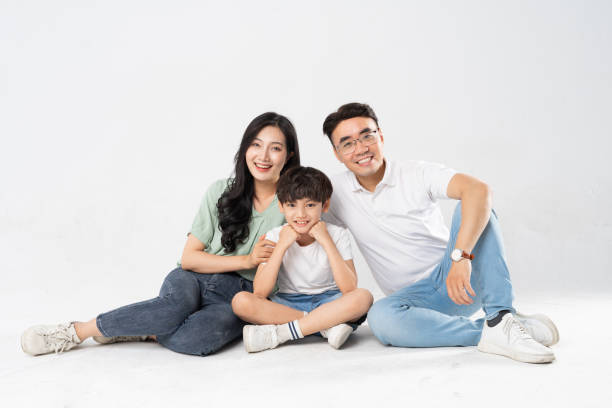 istock a family posing on a white background 1594196941