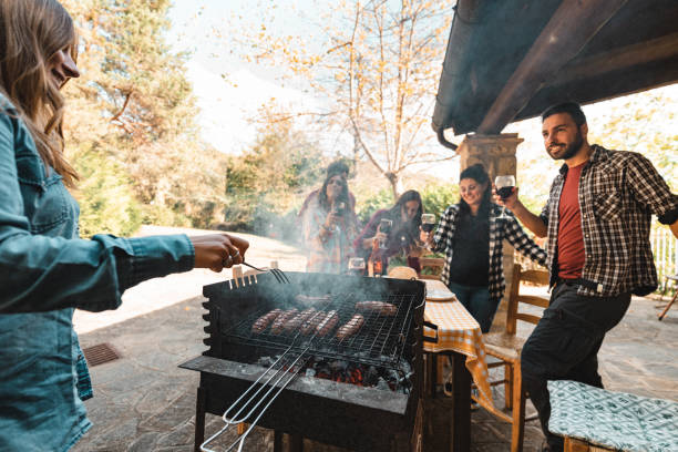istock happiness friends toasting with wine during the bbq 1594198663