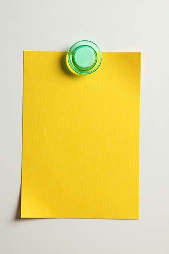 blank yellow note with magnet on the bridge
