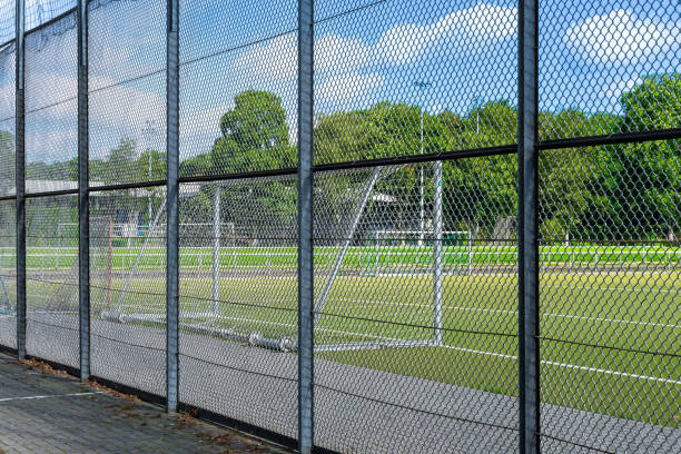 istock Fence against soccer field 1594208849