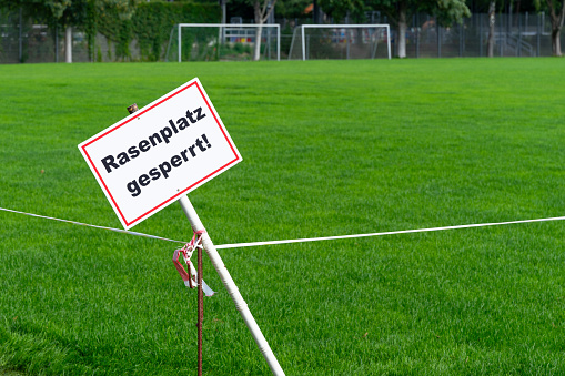 Sign of closed grass field